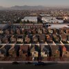This aerial view shows a housing development in Las Vegas on August 8, 2025. The development consists of rows of closely spaced two-story houses.