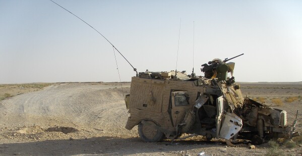 This photo, provided by Martin Tamm Andersen, a former Platoon Leader of the US Marines, shows a destroyed Army vehicle in Helmand Province, Afghanistan, Aug. 19, 2010. (Martin Tamm Andersen via AP)