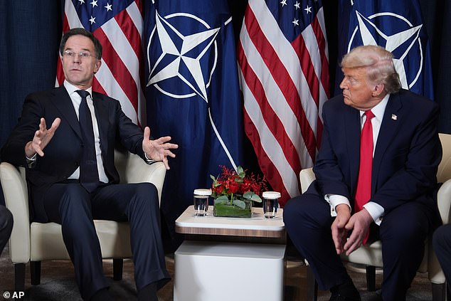 President Donald Trump, right, meets with NATO Secretary General Mark Rutte during a meeting on the sidelines of the Annual Meeting of the World Economic Forum in Davos, Switzerland, Wednesday, Jan. 21, 2026. (AP Photo/Evan Vucci)
