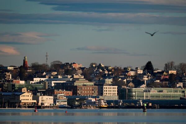 Buildings on the working waterfront catch the early morning light, Feb. 26, 2025, in Portland, Maine. (AP Photo/Robert F. Bukaty, File)