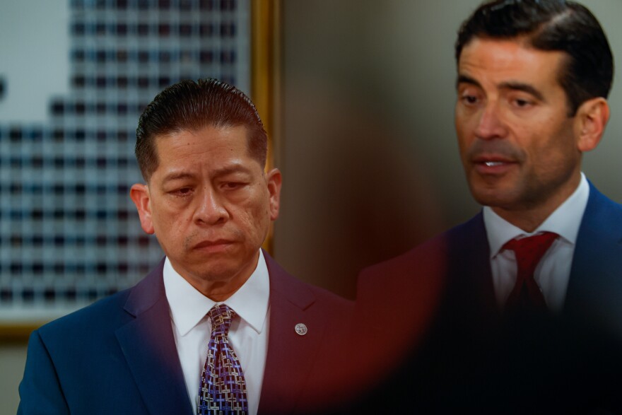 Former Uvalde school district police officer Adrian Gonzales, left, reacts as he stands beside his attorney, Nico LaHood, to answer reporters' questions after the jury found Gonzales not guilty at the Nueces County Courthouse on Wednesday, Jan. 21, 2026, in Corpus Christi, Texas.