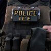 A U.S. Immigration and Customs Enforcement agent is seen in Park Ridge, Ill., Sept. 19, 2025.