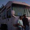 Ellaird Bailey and his wife, Charlotte, who lost their home in Altadena, California, to a wildfire in early 2025, stand in front of their recreational vehicle in December 2025.