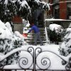 Langley Bowers shovels the snow off his stoop on Capitol Hill in Washington, D.C., on Jan. 6, 2024, as a major snow storm blanketed the city.