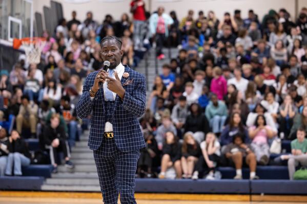 Ian Roberts, superintendent of Des Moines Public Schools, speaks to students at Theodore Roosevelt High School in Des Moines, Oct. 21, 2024. (Jon Lemons/Des Moines Public Schools via AP)