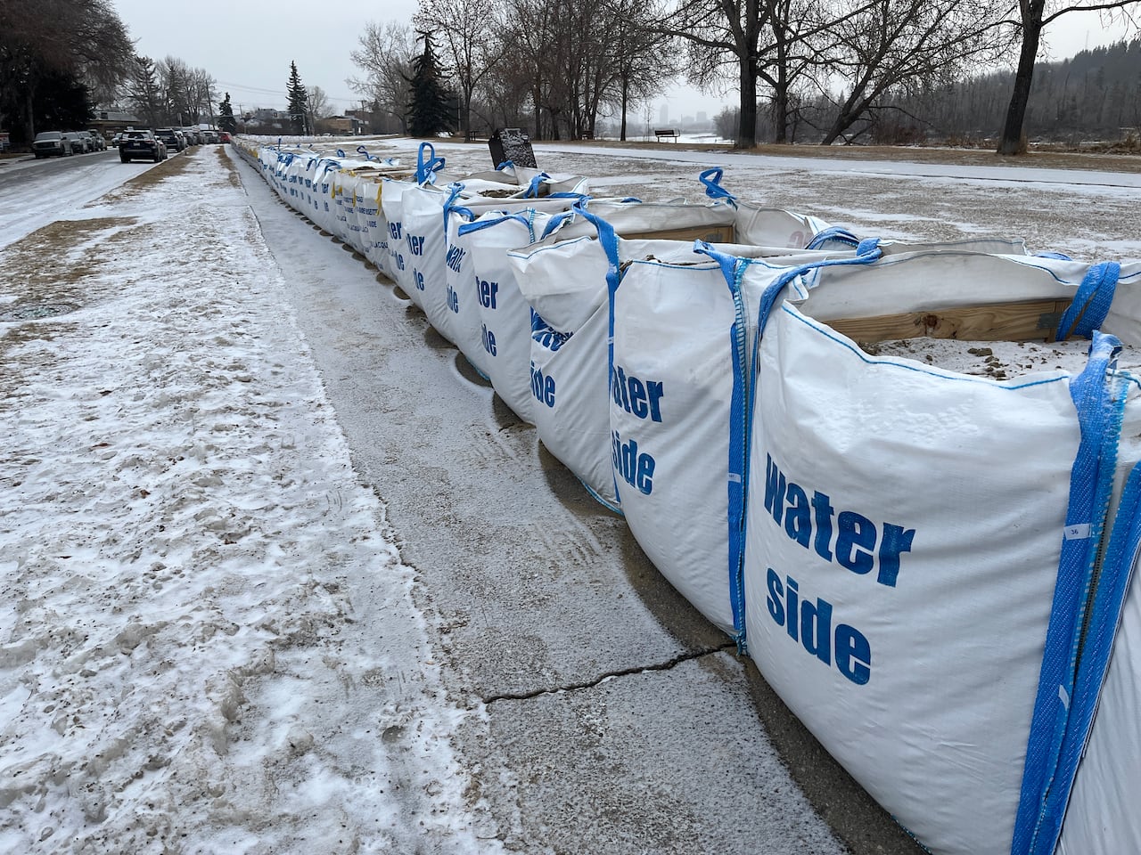 Flood mitigation efforts, like temporary barriers along the Bow River Pathway on Parkdale Blvd. N.W., have been set up in Calgary in case of another water main break bringing more flooding to the area.