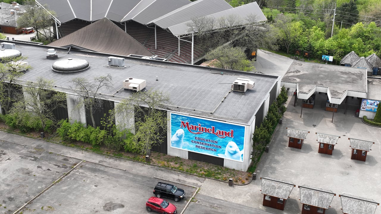arial of empty parking lot and entrance building shot from drone