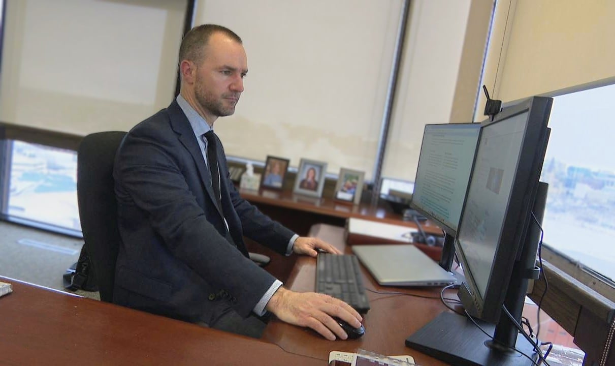 Anthony Durocher, acting senior deputy commissioner of the Competition Bureau, works at his desk.