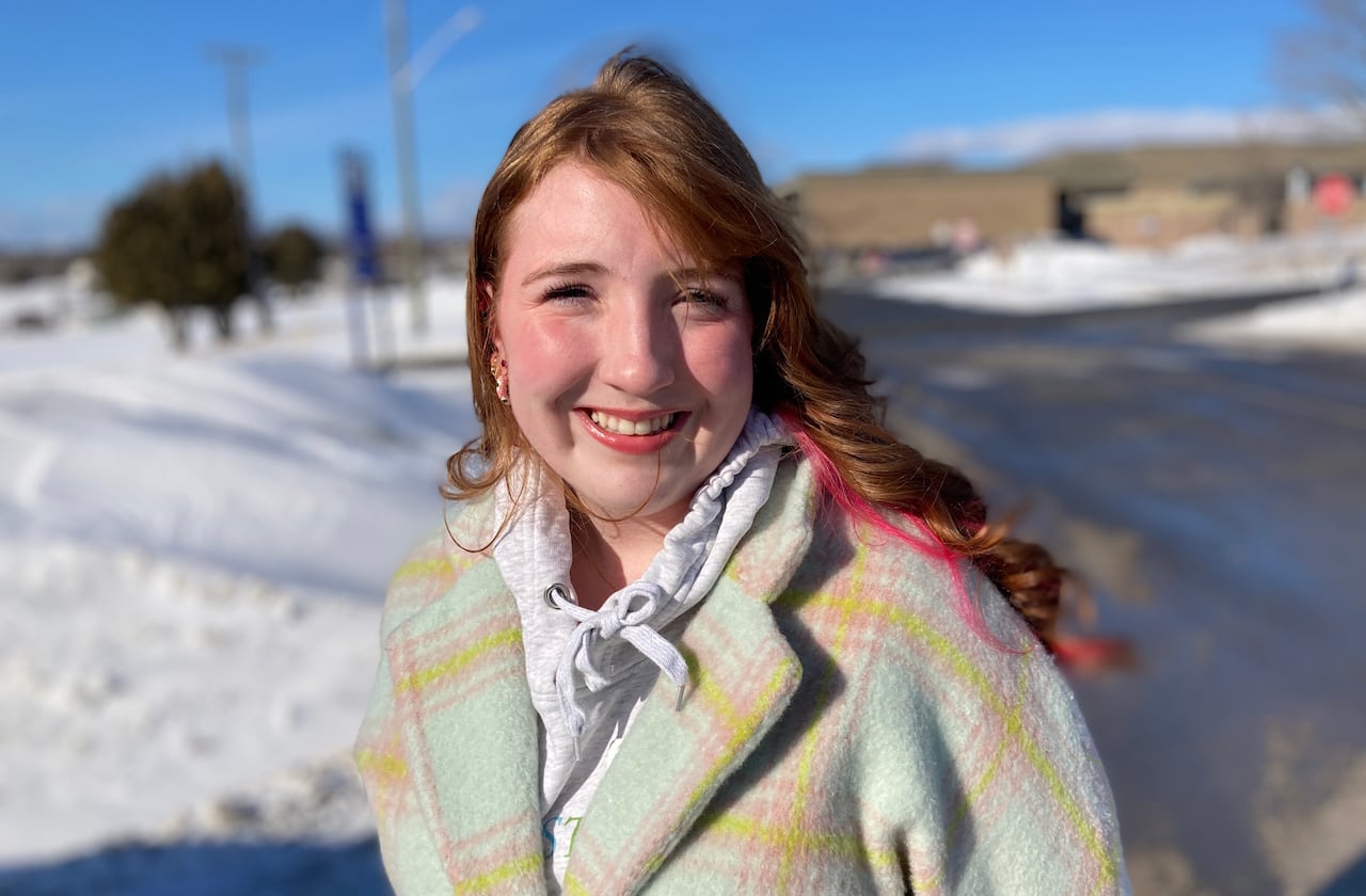 A woman poses for a photo
