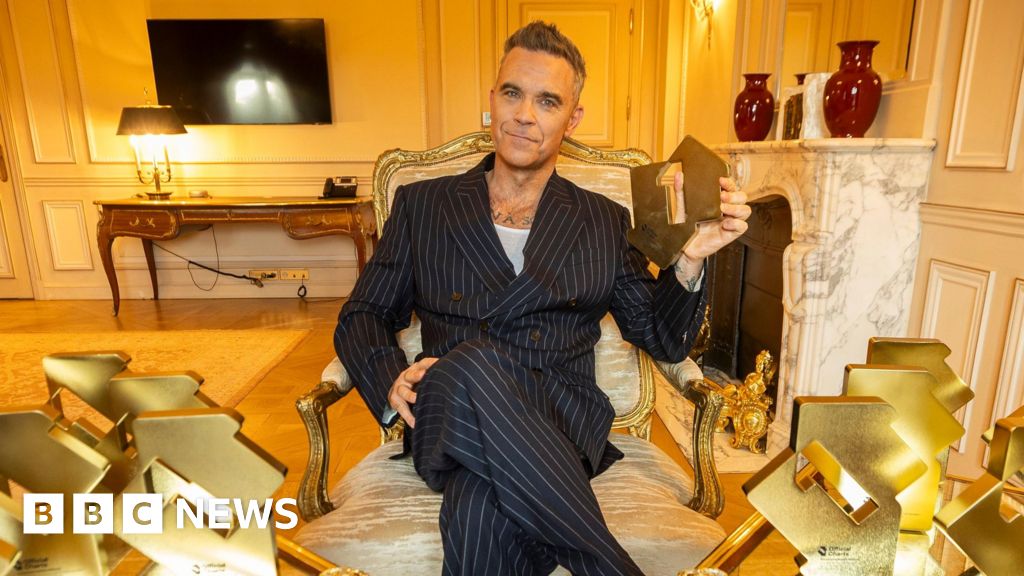 Robbie Williams breaks The Beatles' chart record with his 16th number one album Britpop