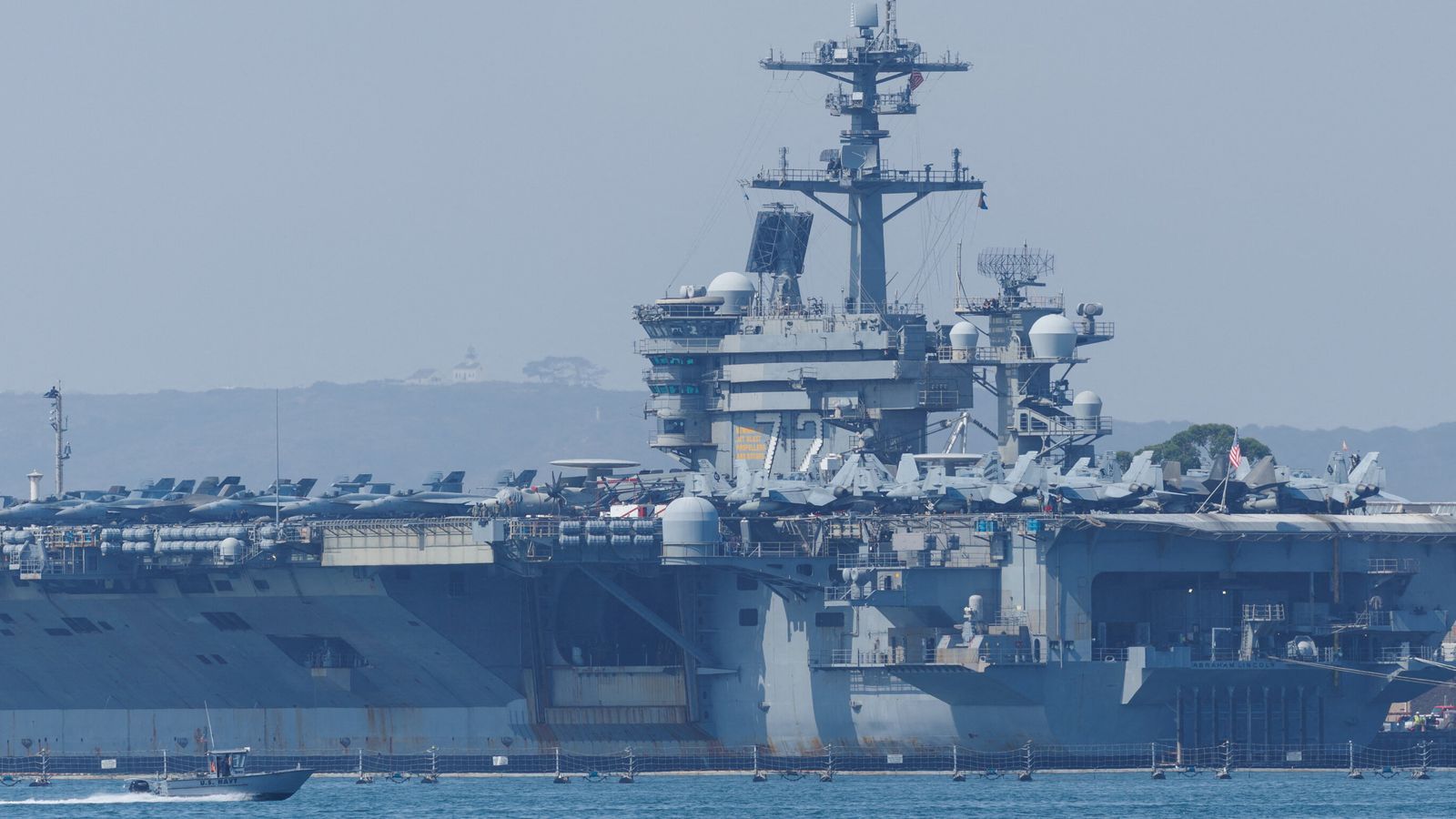 The USS Abraham Lincoln (pictured) and several guided-missile destroyers are due to arrive in the region in the coming days. Pic: Reuters