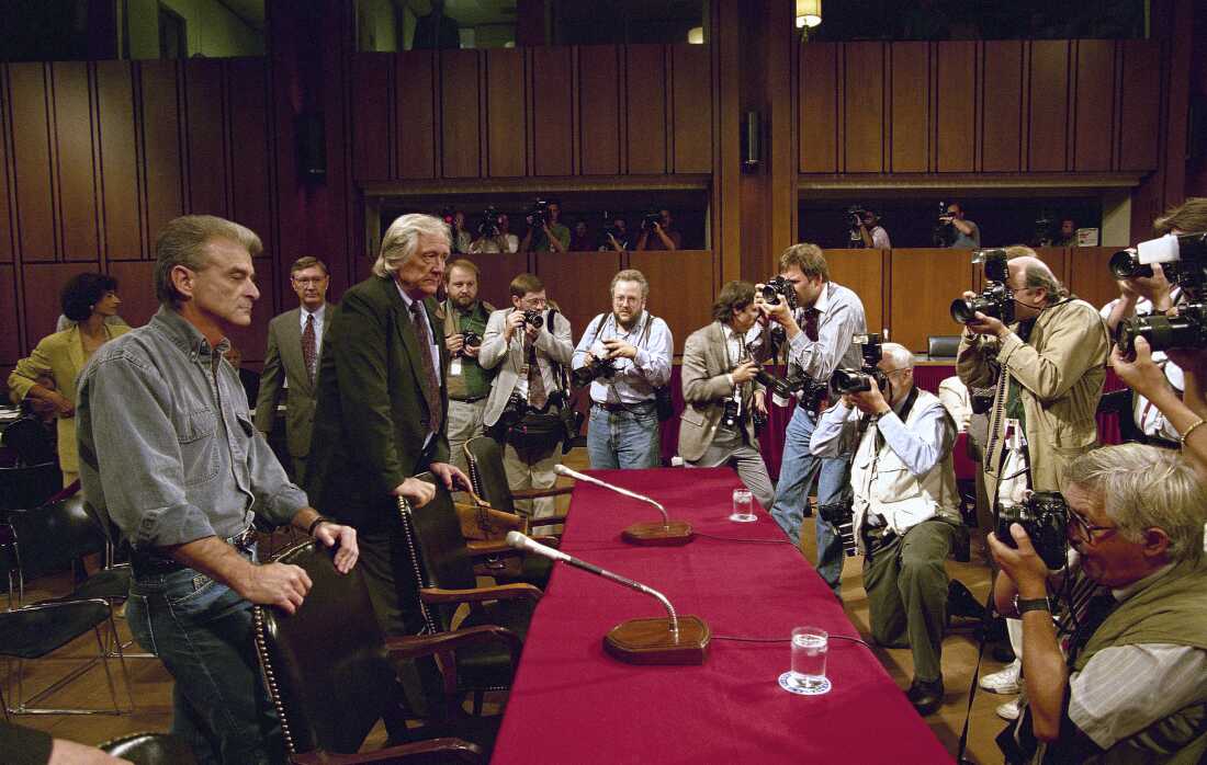 In this Sept. 6, 1995, file photo, photographers capture the arrival on Capitol Hill in Washington of Randy Weaver, left, and his attorney Gerry Spence for a hearing of a Senate Judiciary subcommittee. A 1992 standoff in the remote mountains of northern Idaho left a 14-year-old boy, his mother and a federal agent dead and sparked the expansion of radical right-wing groups across the country.