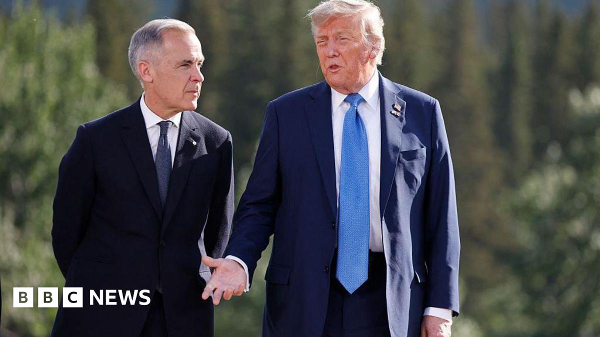 Donald Trump and Mark Carney, both in dark suits, stand together outside
