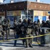 ICE and federal agents face off with Minneapolis residents and protesters following the fatal shooting of a local resident earlier in the day near Nicollet Avenue and West 26th Street in south Minneapolis, Minnesota, Jan. 24, 2026. Photographed by Erin Trieb for NPR.
