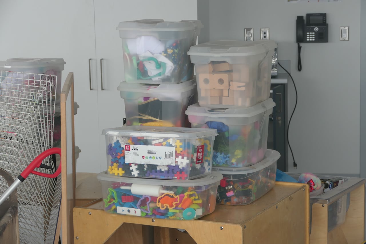 Plastic tubs full of toys.