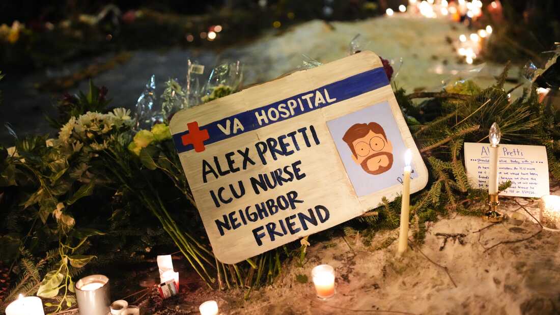 A sign for 37-year-old Alex Pretti, who was fatally shot by a U.S. Border Patrol officer earlier in the day, is displayed during a vigil Saturday, Jan. 24, 2026, in Minneapolis.