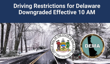 Snowy, wintry road with black ice and DEMA, state logos