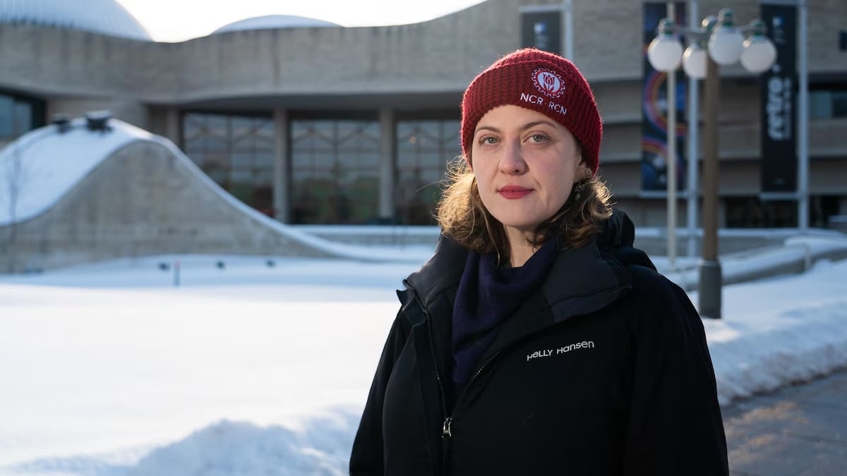 A woman wearing a red hat
