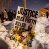 A sign for Alex Pretti, who was killed earlier in the day by a U.S. Border Patrol officer, is displayed during a vigil Saturday, Jan. 24, 2026, in Minneapolis. Zaydee Sanchez for NPR