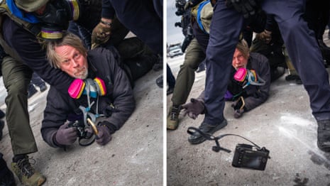 'It's about freedom of the press': photographer tackled by ICE throws camera to save it – video