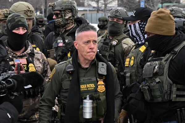 U.S. Customs and Border Protection Commander Gregory Bovino arrives as protesters gather outside the Bishop Henry Whipple Federal Building, Thursday, Jan. 8, 2026, in Minneapolis, Minn. (AP Photo/Tom Baker)