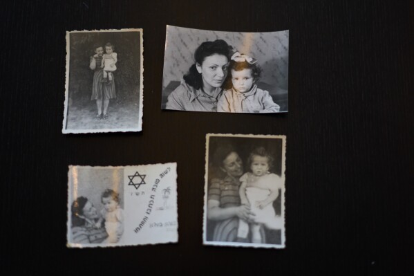Photos of Holocaust survivor Ilana Kantorowicz Shalem born in the Nazi Bergen-Belsen concentration camp with her with mother Lola in the camp in 1946, in Tel Aviv, Israel, Jan. 26, 2026. (AP Photo/Ariel Schalit)