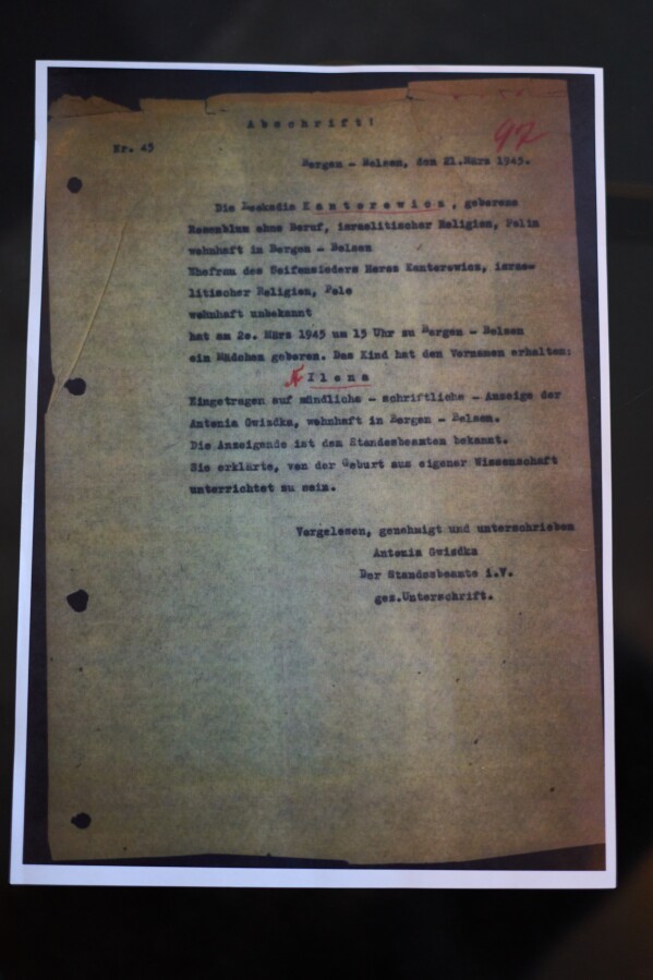 A photo of the birth certificate of Holocaust survivor Ilana Kantorowicz Shalem, born in the Nazi Bergen-Belsen concentration camp in 1946 , is on display in Tel Aviv, Israel, Jan. 26, 2026. (AP Photo/Ariel Schalit)