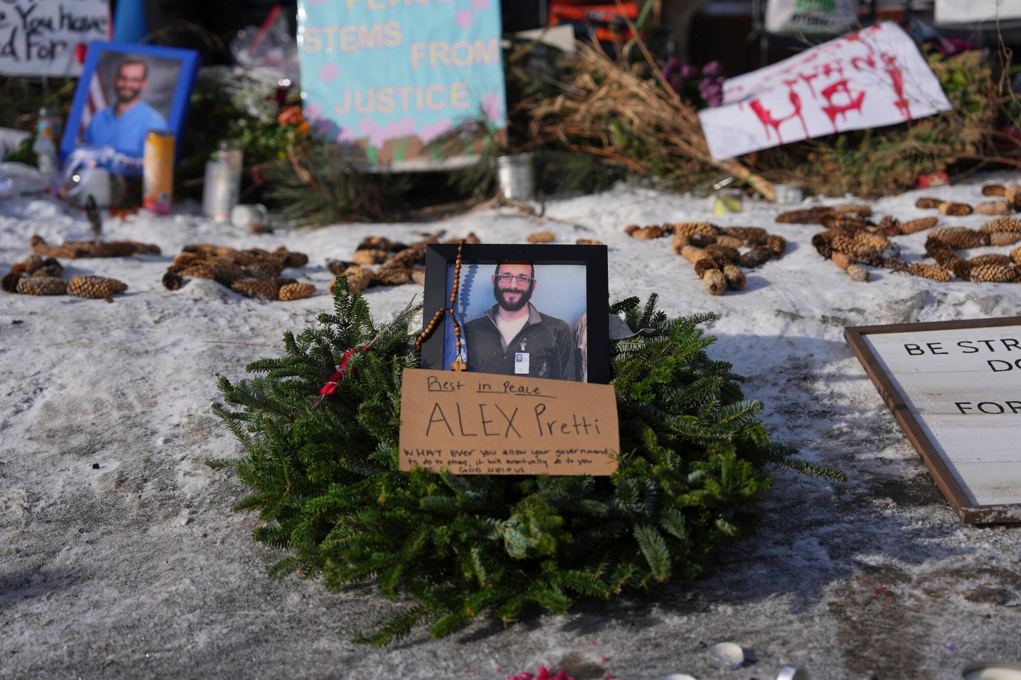 A makeshift memorial is placed on Sunday in the spot where Alex Pretti was fatally shot by U.S. border patrol officers.