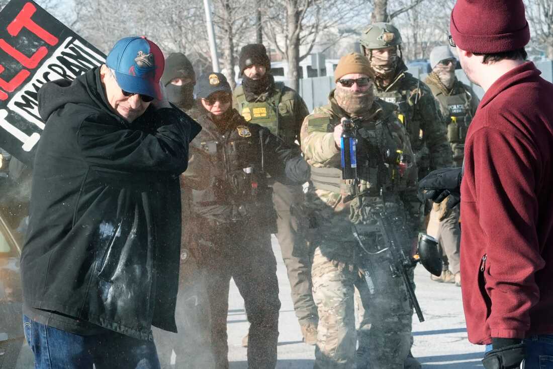 Border Patrol police disperse pepper spray at demonstrators, Sunday, Jan. 11, 2026, in Minneapolis. (AP Photo/Jen Golbeck)