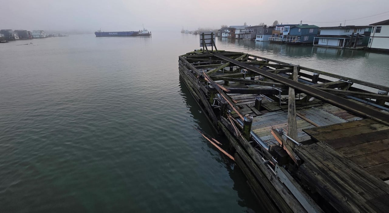 Splinters from a wooden structure is seen on a cloudy day.
