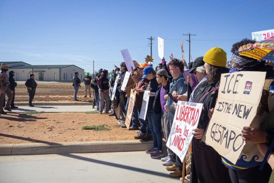Protesters lining up across from DPS troopers outside of the Dilley ICE detention facility.