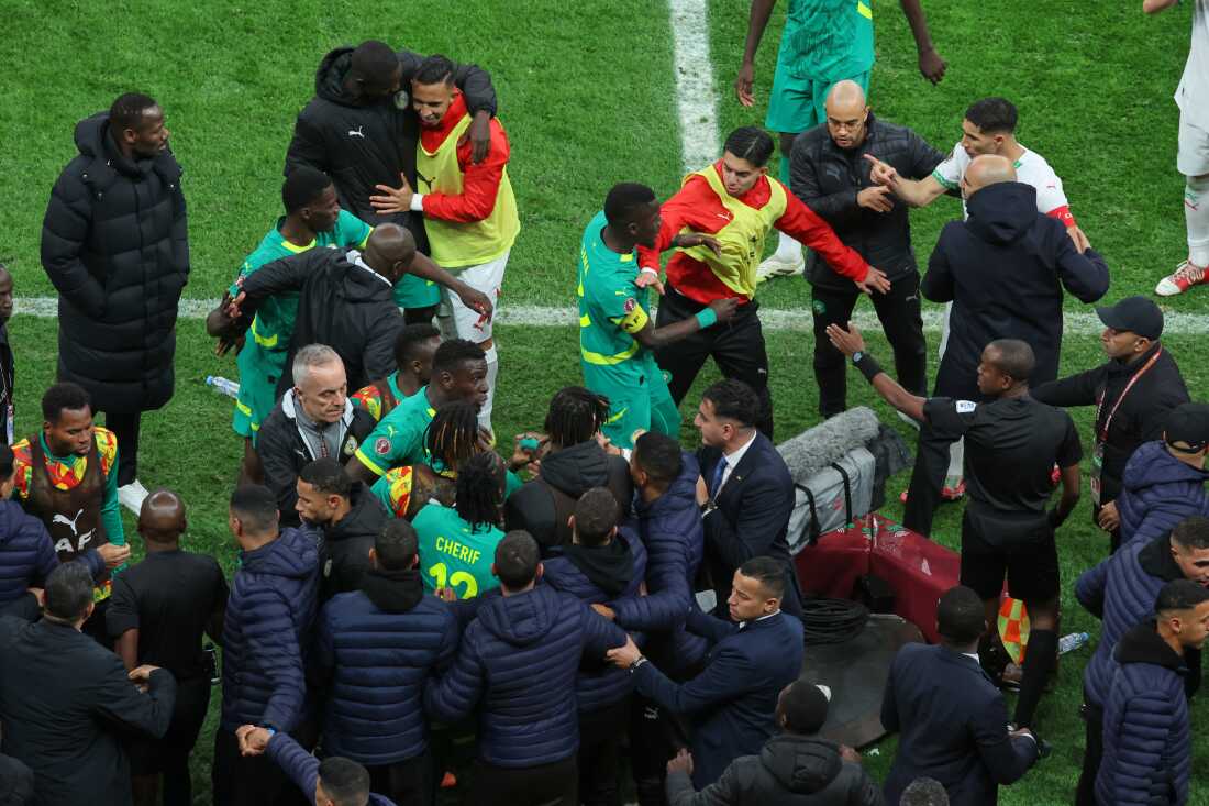Players from both sides clash after a controversial penalty was awarded to Morocco late on during the Africa Cup of Nations final soccer match between Senegal and Morocco in Rabat, Morocco, Sunday, Jan. 18, 2026.