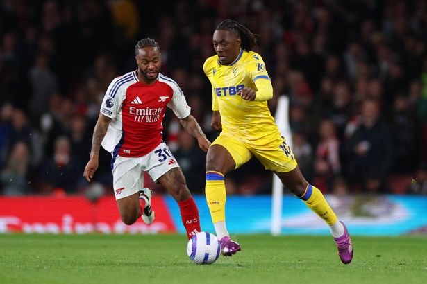 Raheem Sterling and Eberechi Eze compete for the ball.