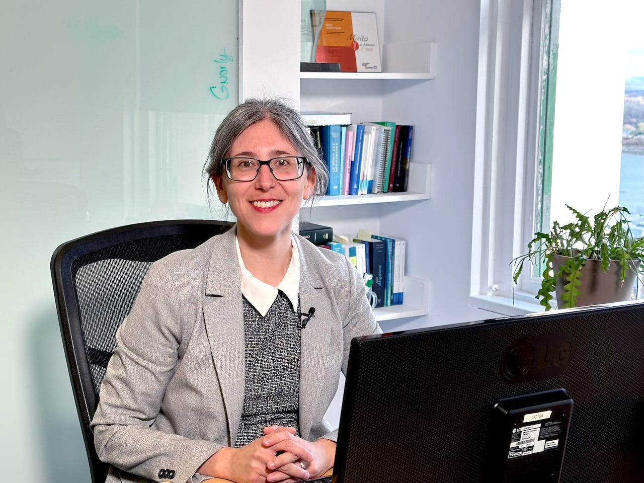 Sara Eve Levac, a lawyer with consumer advocacy group Option Consommateurs, sits in front of a computer.