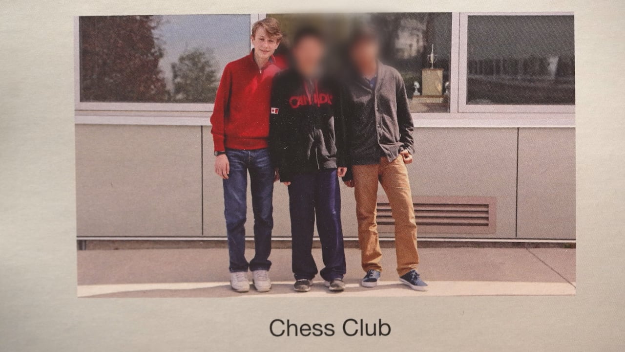 Andean Medjedovic poses with two other students for the chess club photo. 