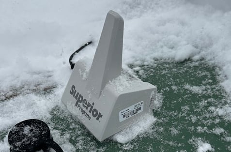 a white pyramid shaped plastic sensor with the word superior on it