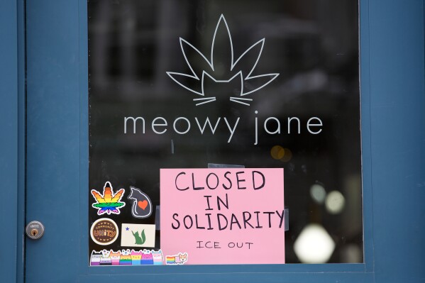 A sign at a cannabis shop indicates it is closed for the general strike to support the state's immigrant community Friday, Jan. 30, 2026, in Portland, Maine. (AP Photo/Robert F. Bukaty)
