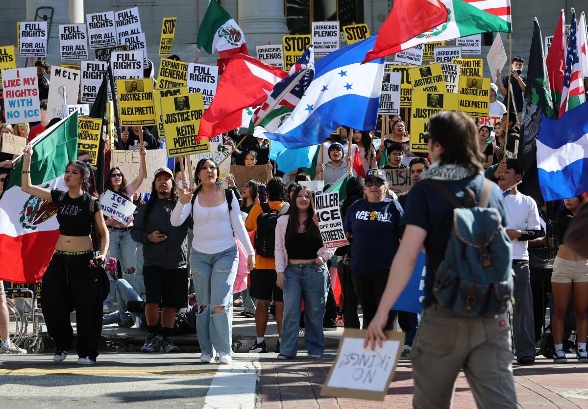 Protesters march down the street.