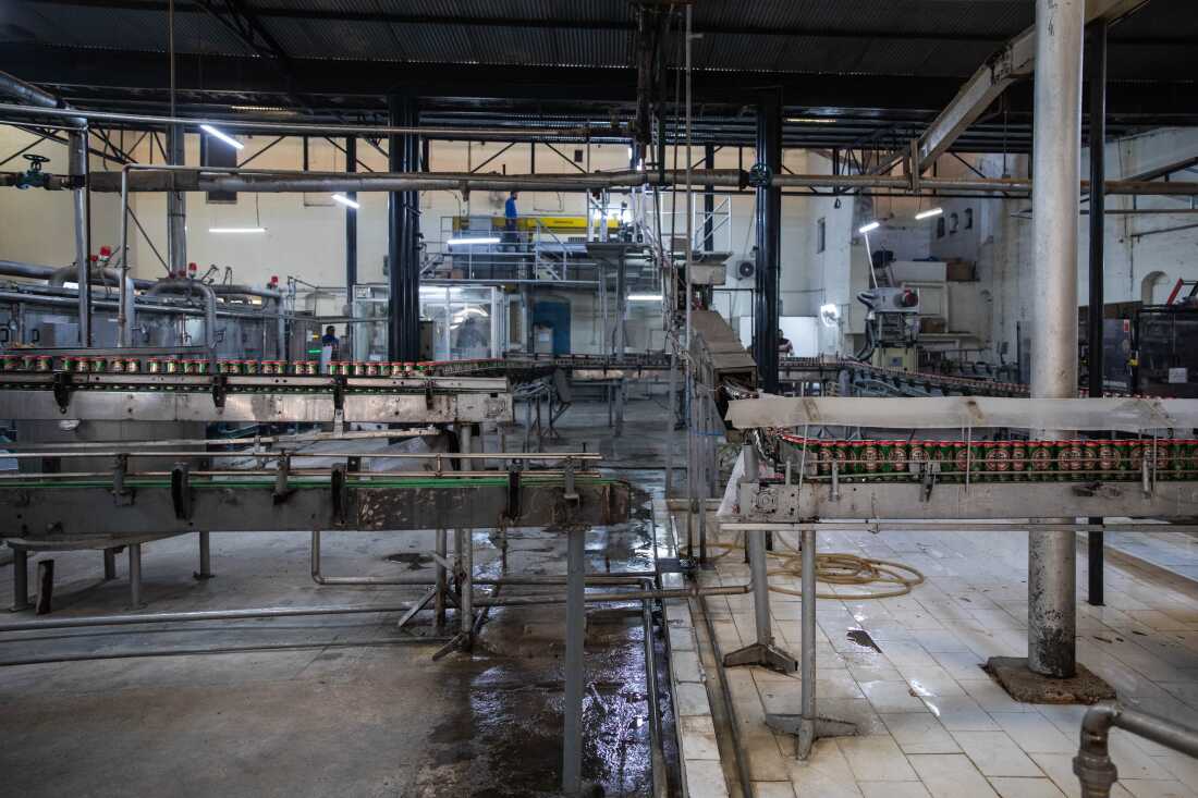 Cans of beer move down a production line at the Murree Brewery factory on Nov. 29, 2025 in Rawalpindi, Pakistan.