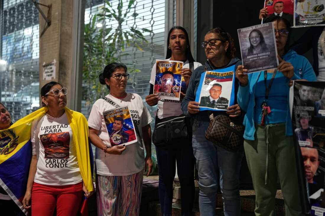 Relatives of detainees gather the near El Helicoide, headquarters of Venezuela's intelligence service and a detention center, in Caracas, Venezuela, Friday, Jan. 30, 2026.