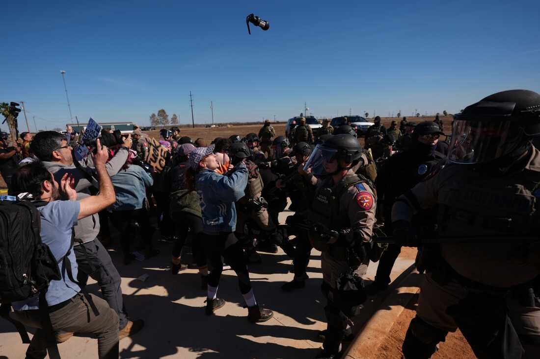 A canister of pepper spray launched by Texas troopers flies towards protesters outside the South Texas Family Residential Center detention facility where Liam Ramos and his father are being detained in Dilley, Texas, Wednesday, Jan. 28, 2026.
