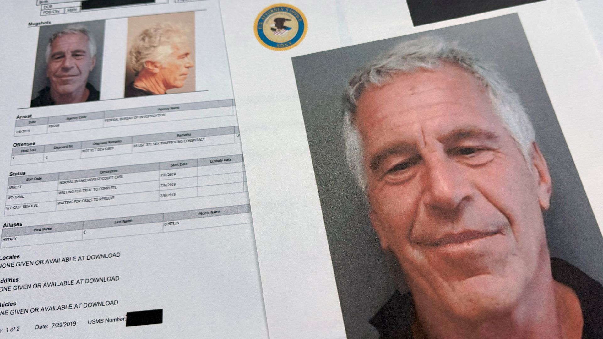 Documents that were included in the U.S. Department of Justice release of the Jeffrey Epstein files are photographed Friday, Jan. 2, 2026.
