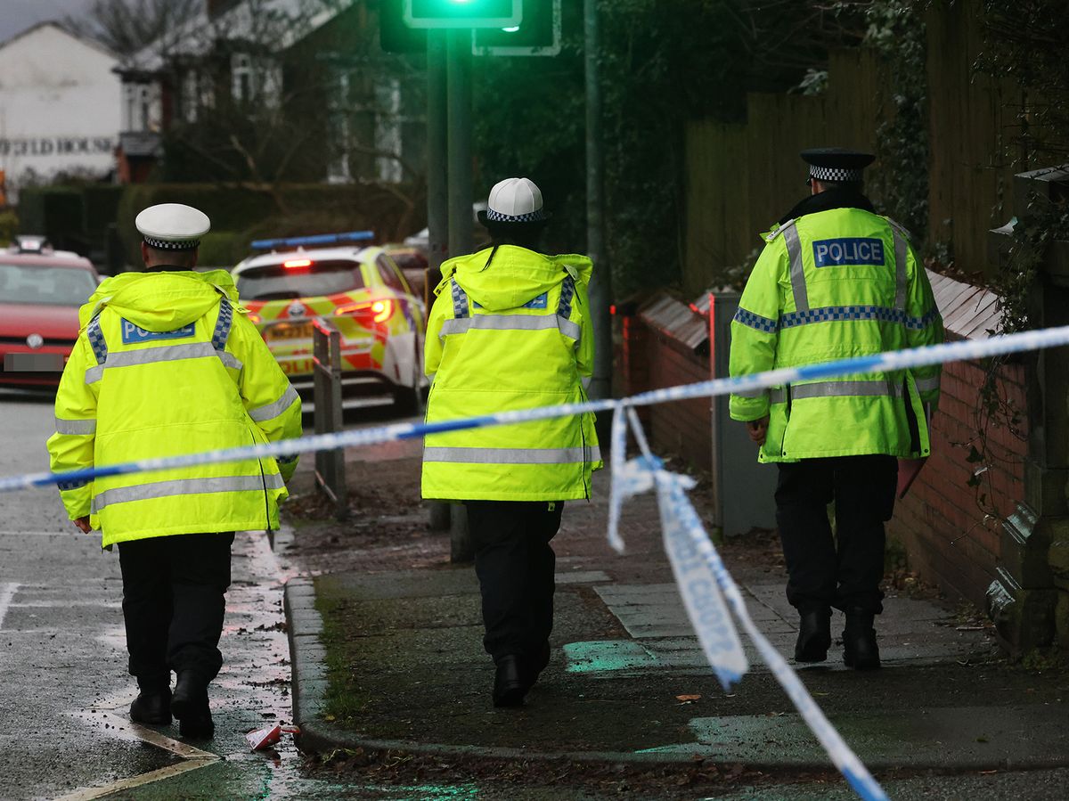 Police on the scene of the fatal crash on Wigan Road in Bolton