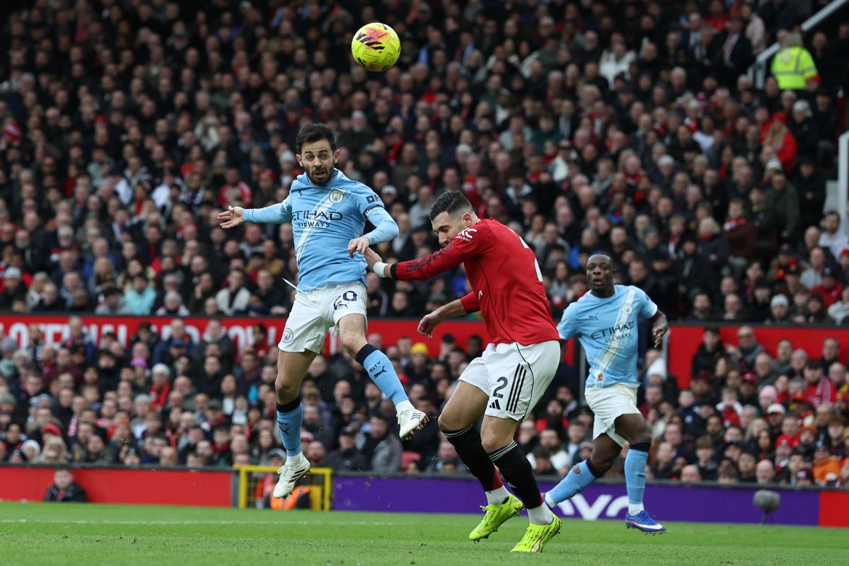 Bernardo Silva attempts to direct a header goalwards for Manchester City vs Manchester United