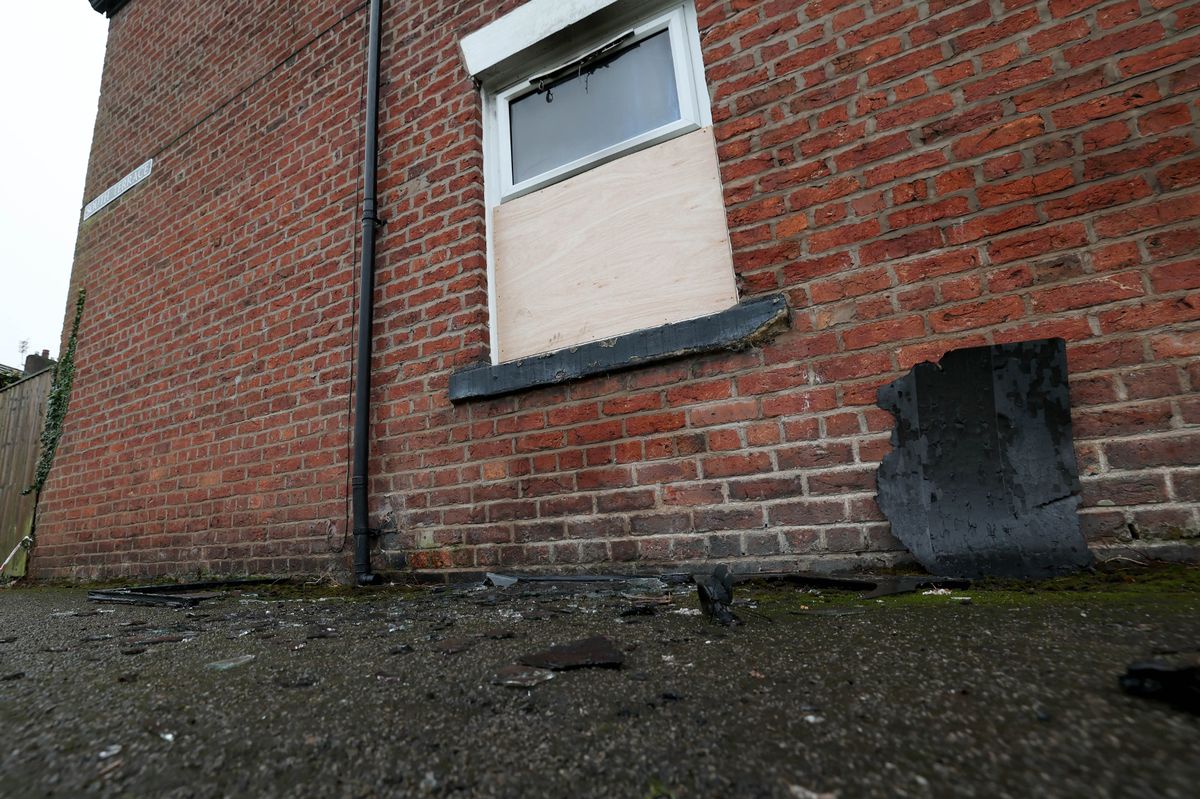 The window was put through before the house was set alight