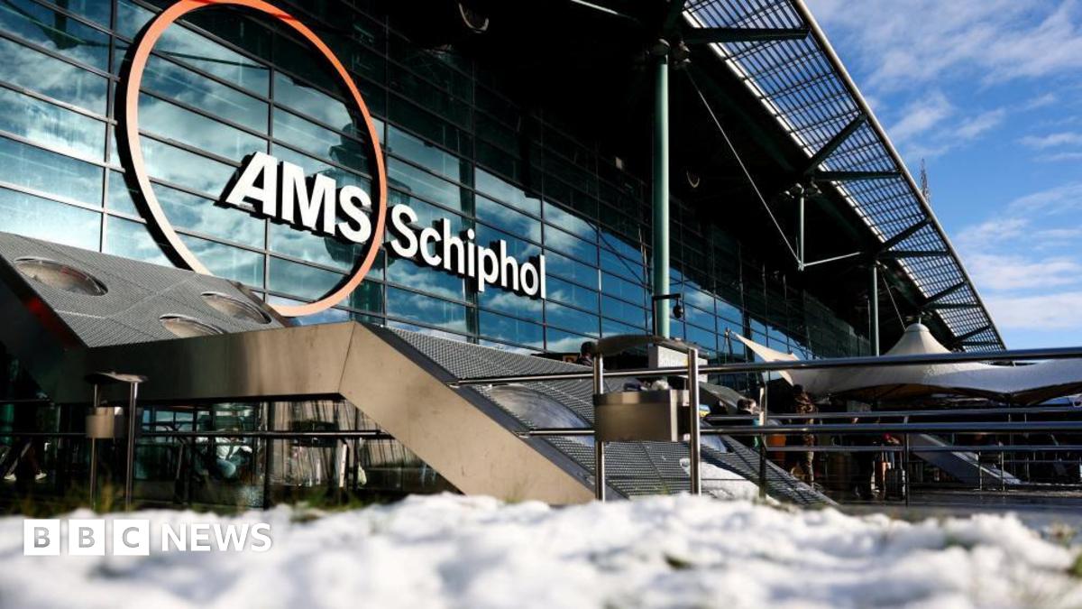 Snow lies on ground outside Schiphol Airport in Amsterdam