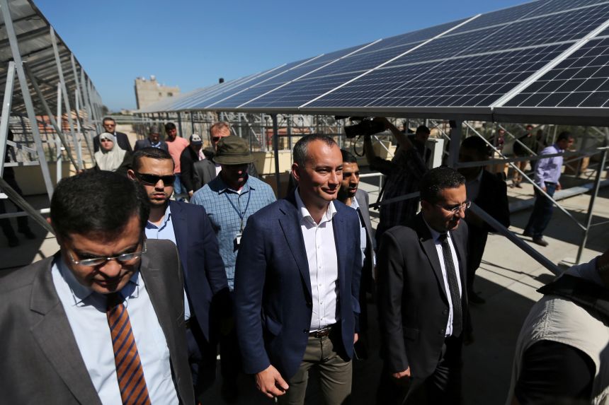 Nickolay Mladenov, center, then-UN Special Coordinator for the Middle East Peace Process, visits a solar energy project at Nasser hospital in the southern Gaza Strip on May 13, 2019.