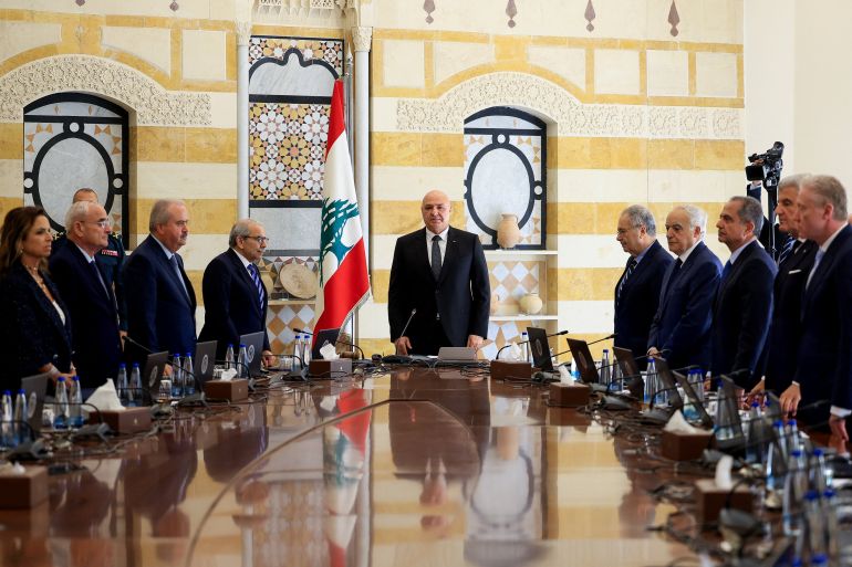 Lebanese President Joseph Aoun, Prime Minister Nawaf Salam and members of the cabinet stand as they attend a cabinet session to discuss the army's plan to disarm Hezbollah, at the Presidential Palace in Baabda, Lebanon, September 5, 2025. REUTERS/Mohamed Azakir