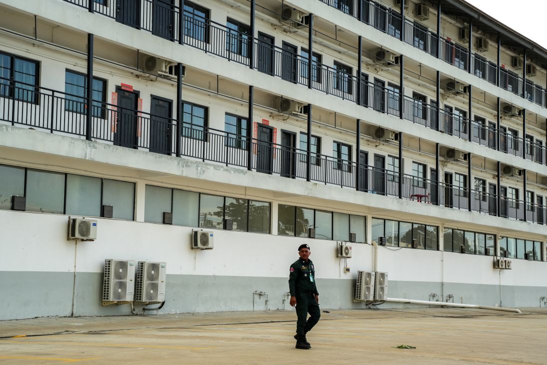 A Cambodian officer patrols a guarded compound visited by South Korea's Vice Foreign Minister after talks with the Cambodian Prime Minister, on October 16, 2025.