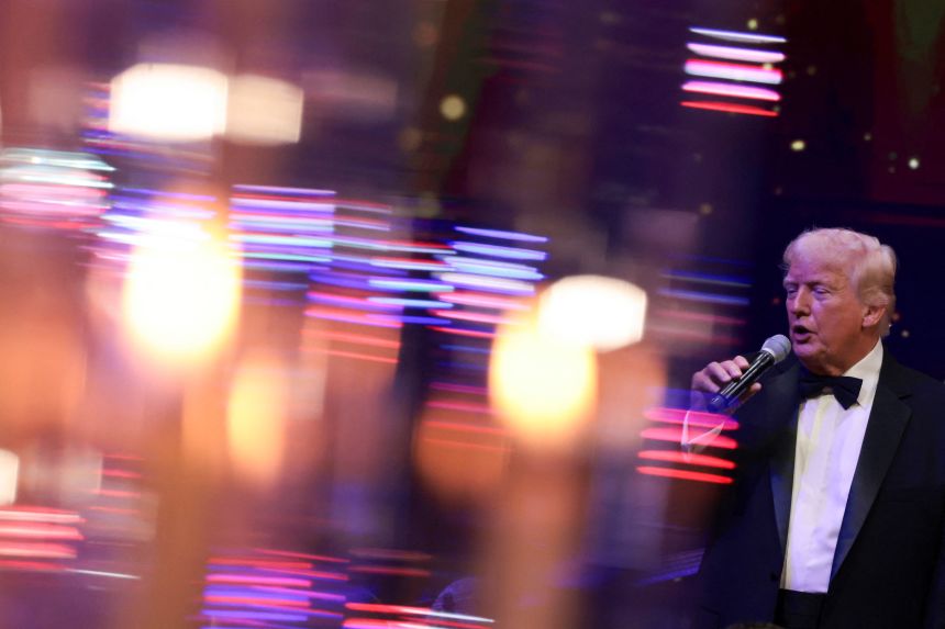 US President Donald Trump attends a New Year's Eve party at his Mar-a-Lago Club in Palm Beach, Florida, on December 31, 2025.